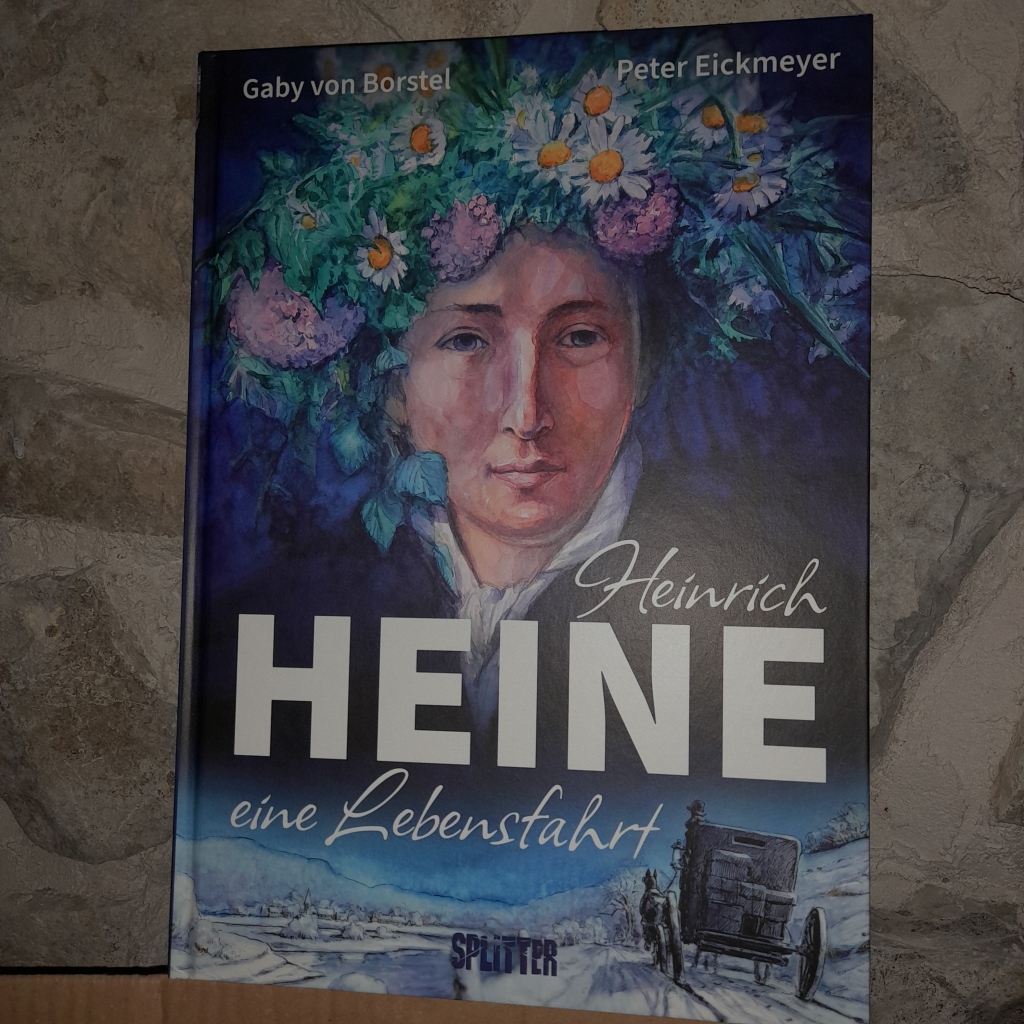 Buch "Heinrich Heine - eine Lebensfahrt" von Gaby von Borstel und Peter Eickmeyer. Das gemalte Cover zeigt ein Heine-Porträt, auf dem der Dichter einen Blumenkranz trägt und eine Kutsche, die durch eine Winterlandschaft fährt